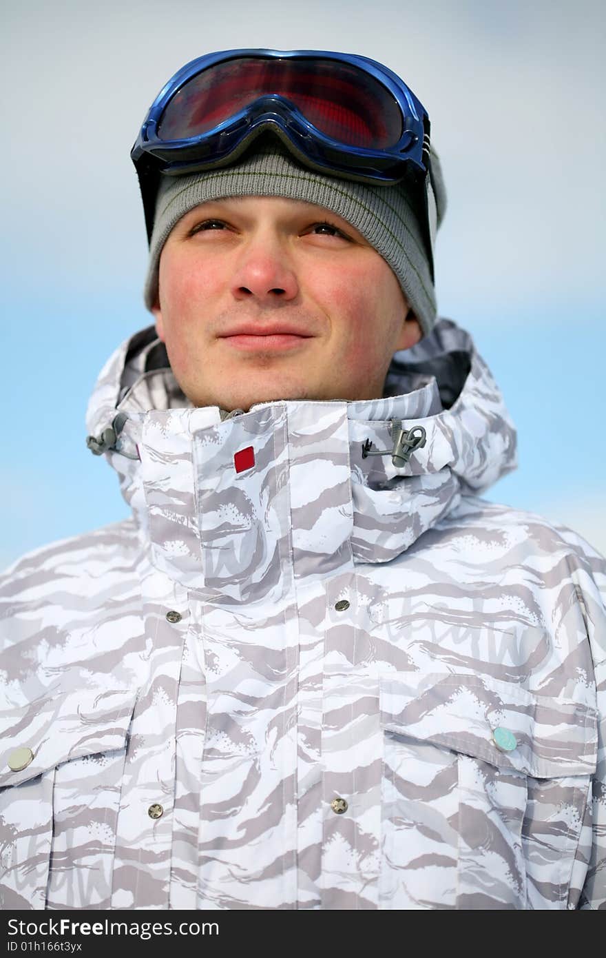 Snowboarder portrait. Winter day photo.