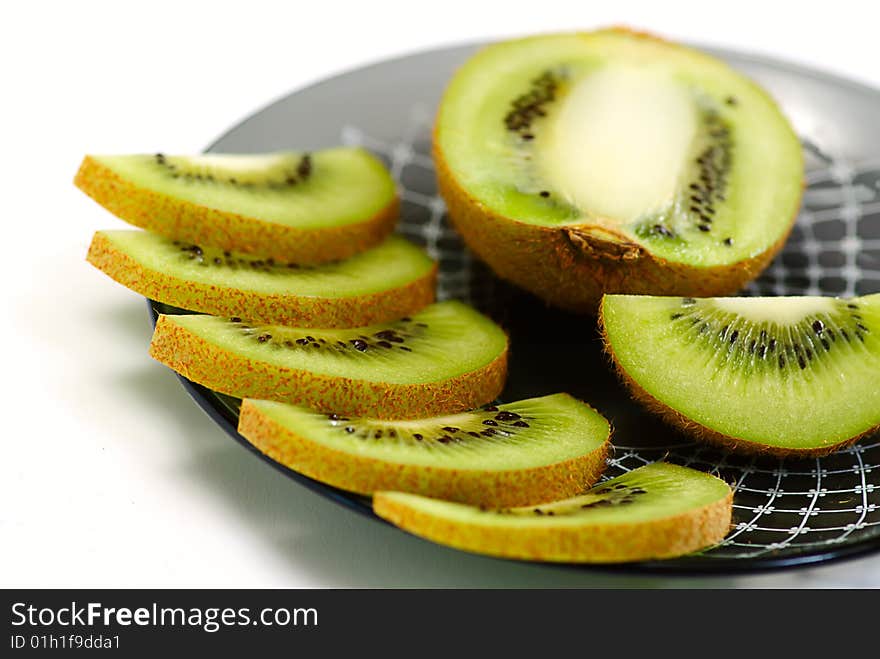 Slice fresh kiwi on plate