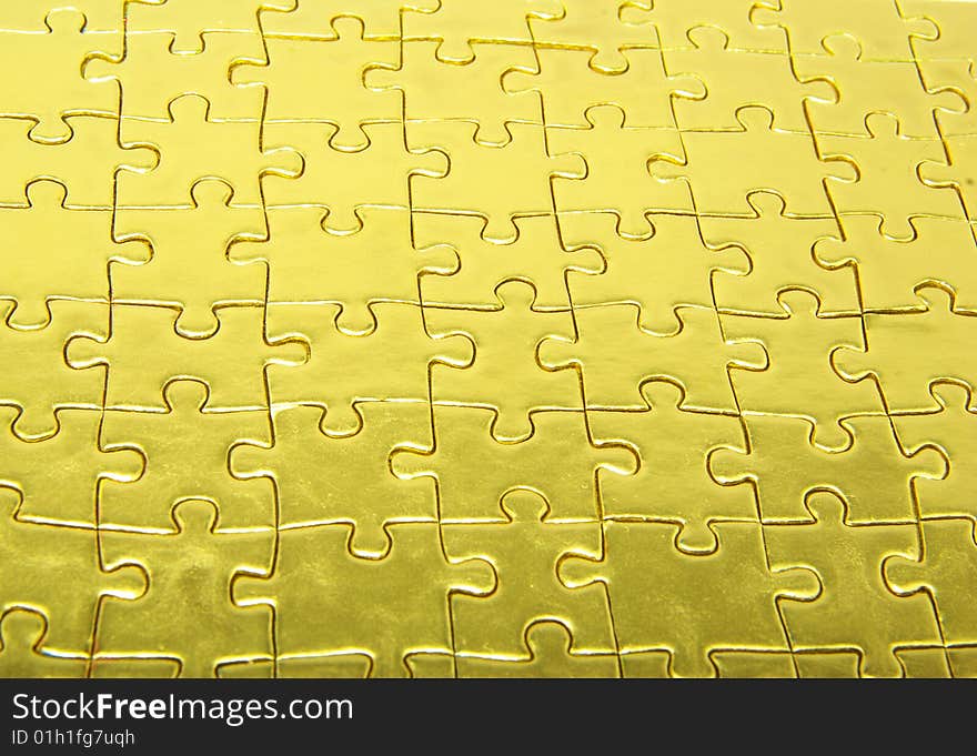 Background of gold jigsaw puzzle