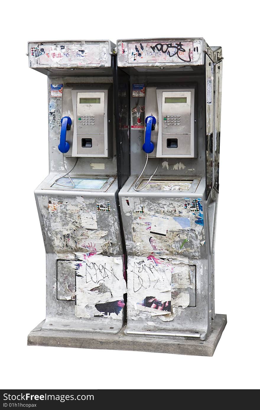 Payphones covered with graffiti and bills in Paris, France