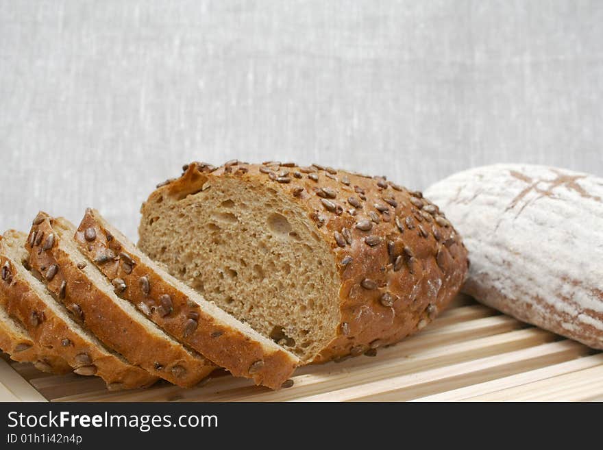 Sliced loaf of cereal bread on the board