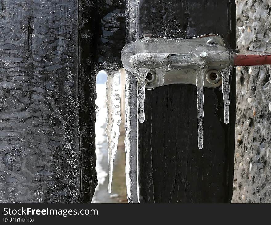 Icicles hanging on bolt, winter image