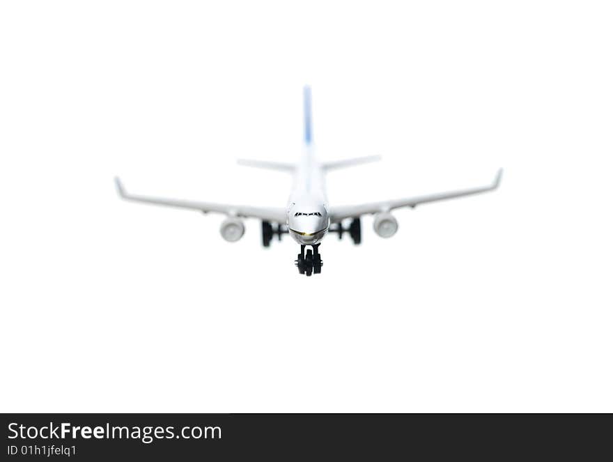 Toy airplane towards white background