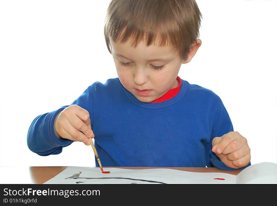 Cute child drawing with brush