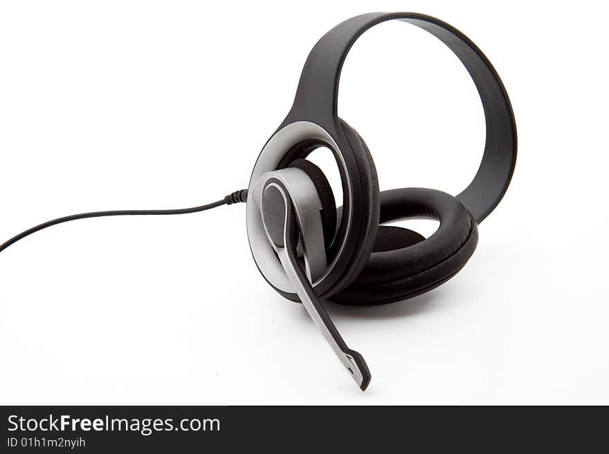 A black stereo headset isolated on a white background