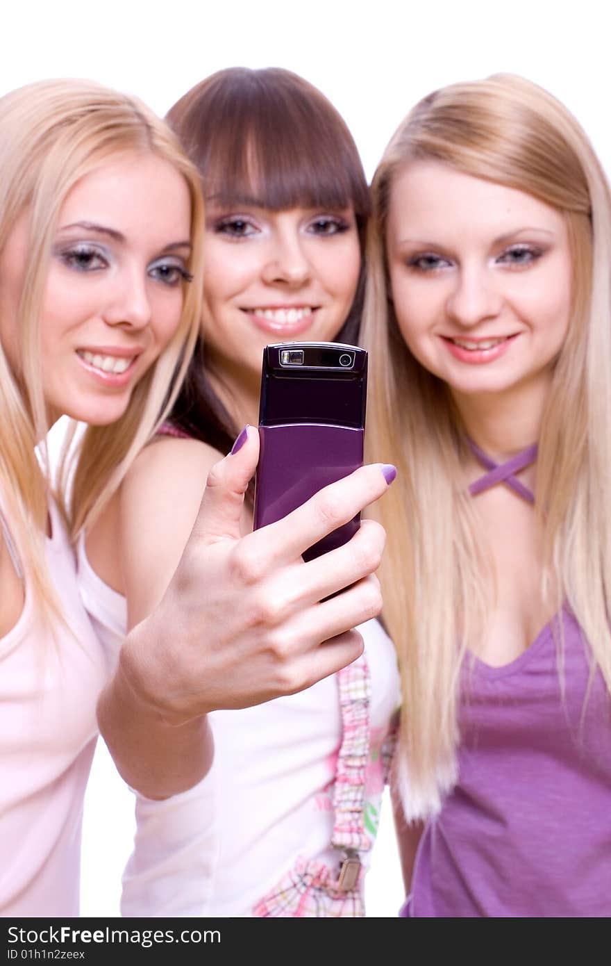 Three girls with phone on a white background