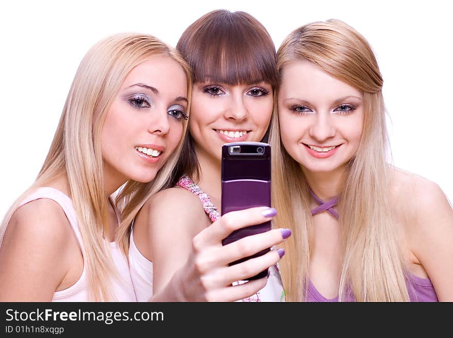 Three girls with phone on a white background