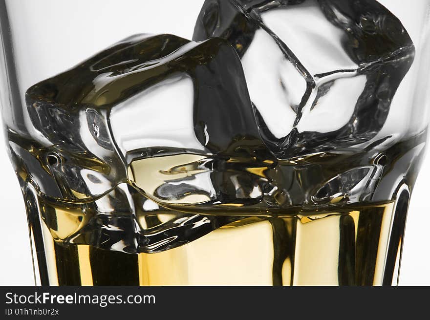 Macro Shoot of Whiskey in Glass with Ice