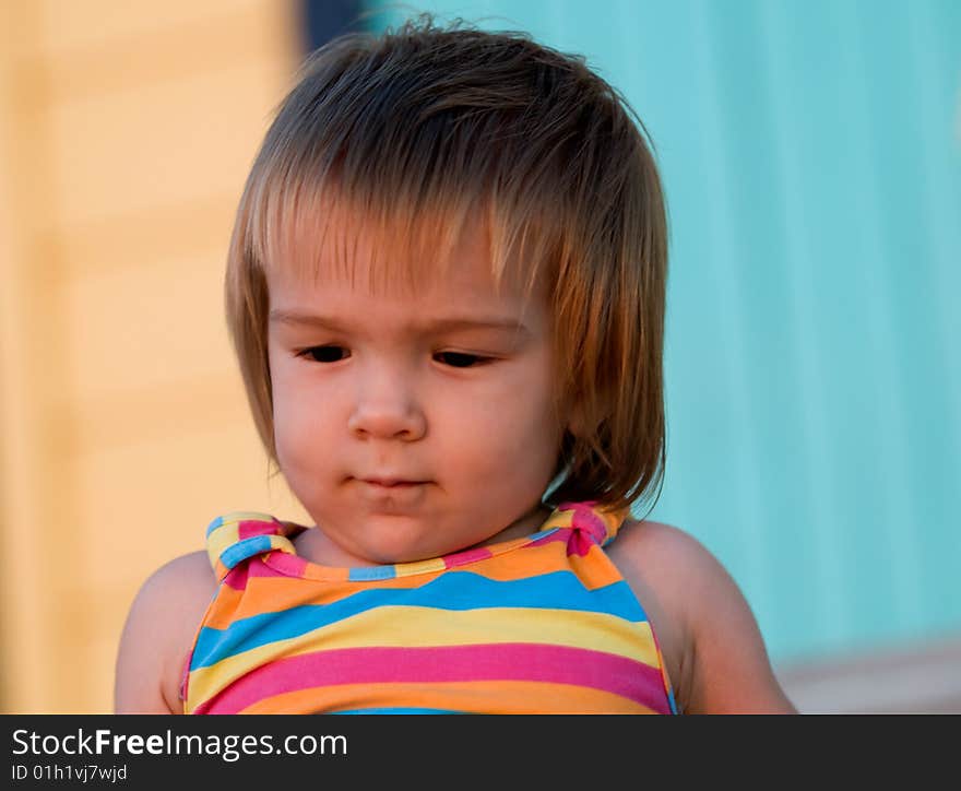 A baby-girl playing on a beach down-under. A baby-girl playing on a beach down-under