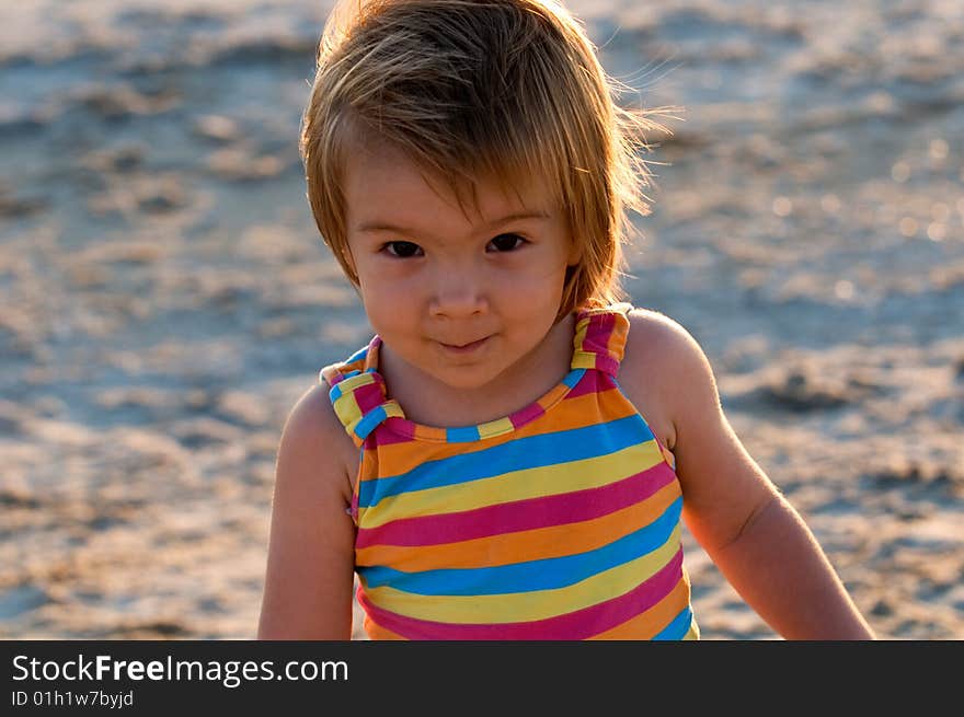 A baby-girl playing on a beach down-under. A baby-girl playing on a beach down-under