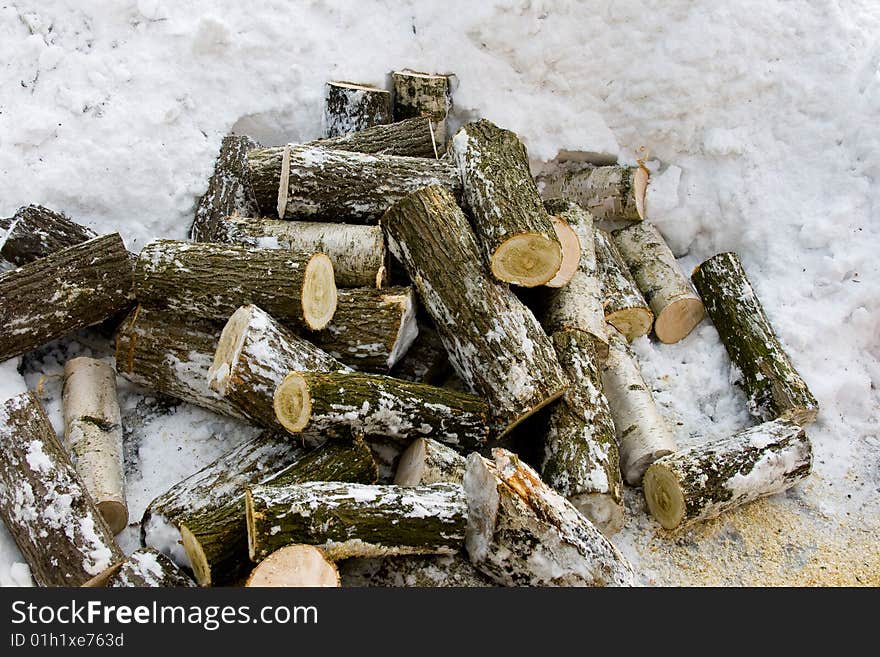 Cut of the wood on the fuel in the winter day. Cut of the wood on the fuel in the winter day