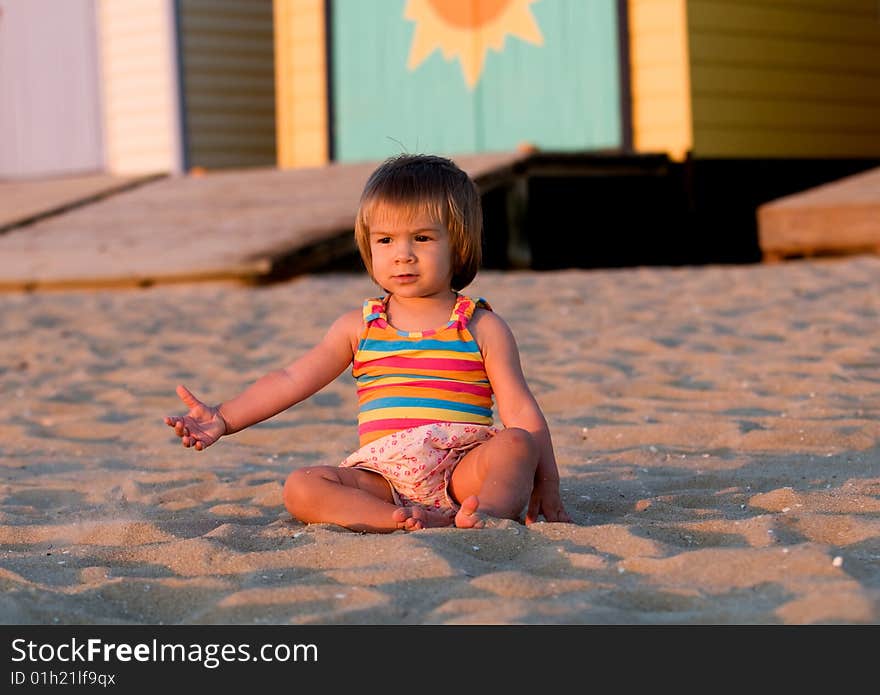 A baby-girl playing on a beach down-under. A baby-girl playing on a beach down-under