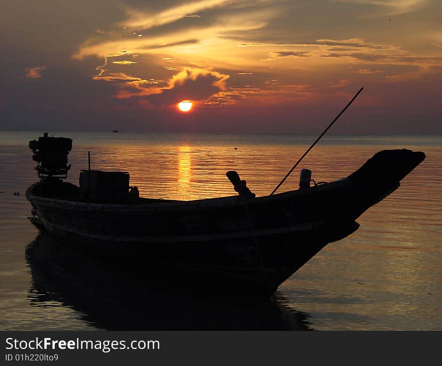 Thai longtail boat at rest waiting for sunset. Thai longtail boat at rest waiting for sunset