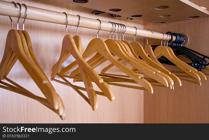 Wooden coat hangers, concept of clothing and fashion.