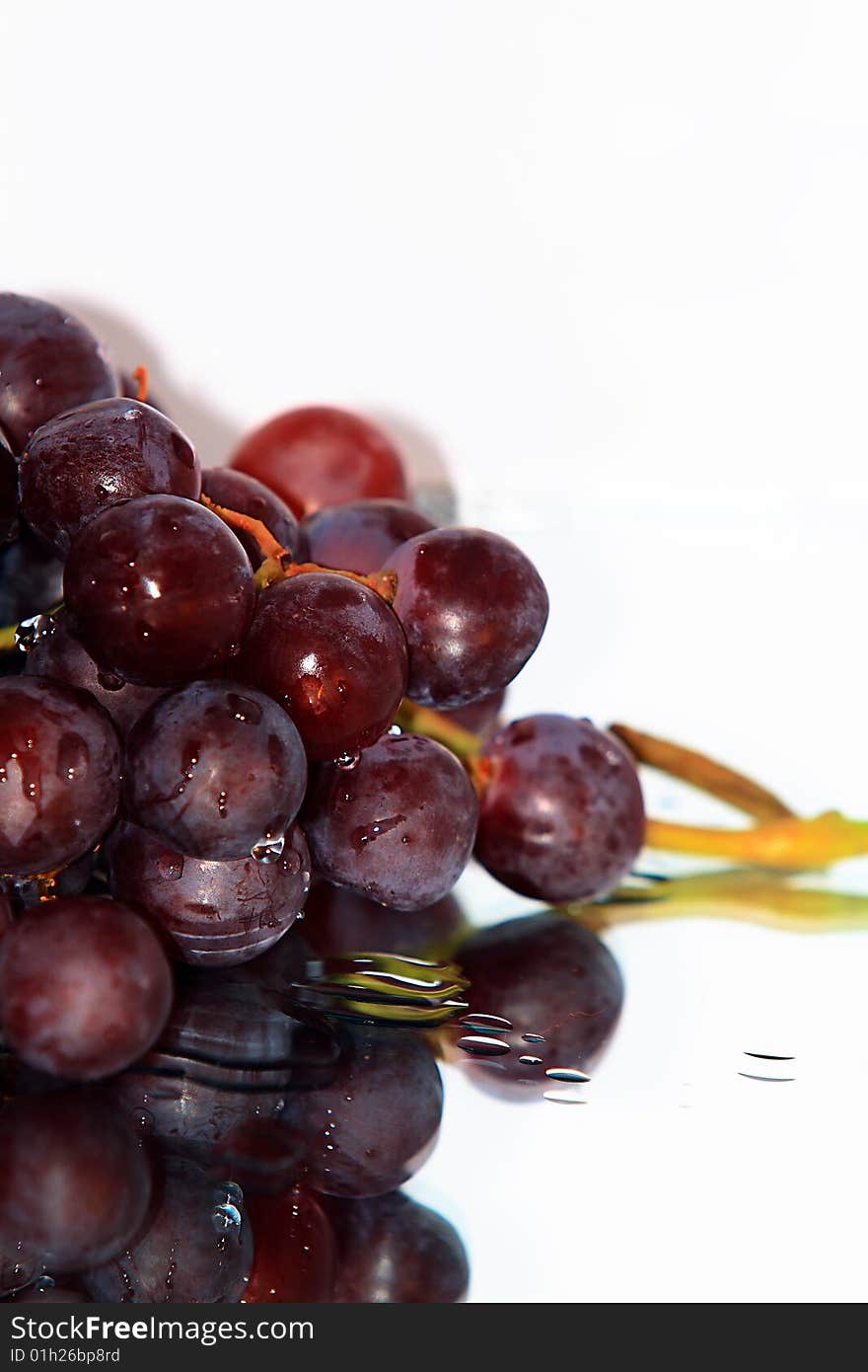 Cluster of pink grape isolated on white background