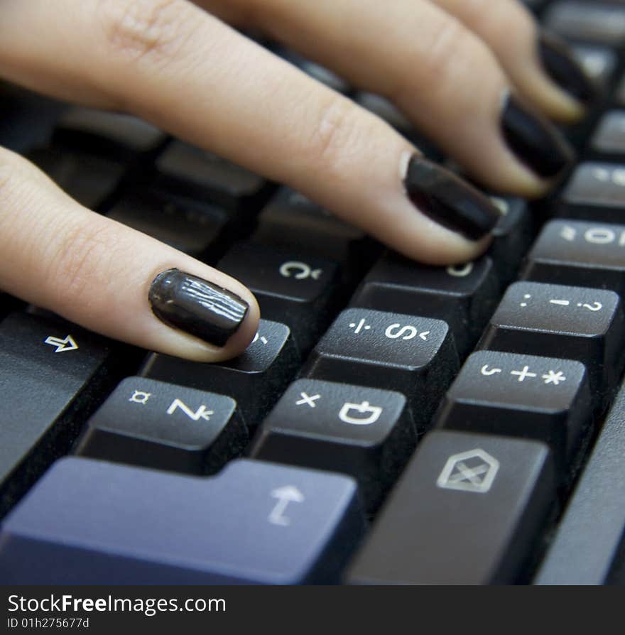 Computer keyboard and woman`s hands typing on it. Computer keyboard and woman`s hands typing on it.