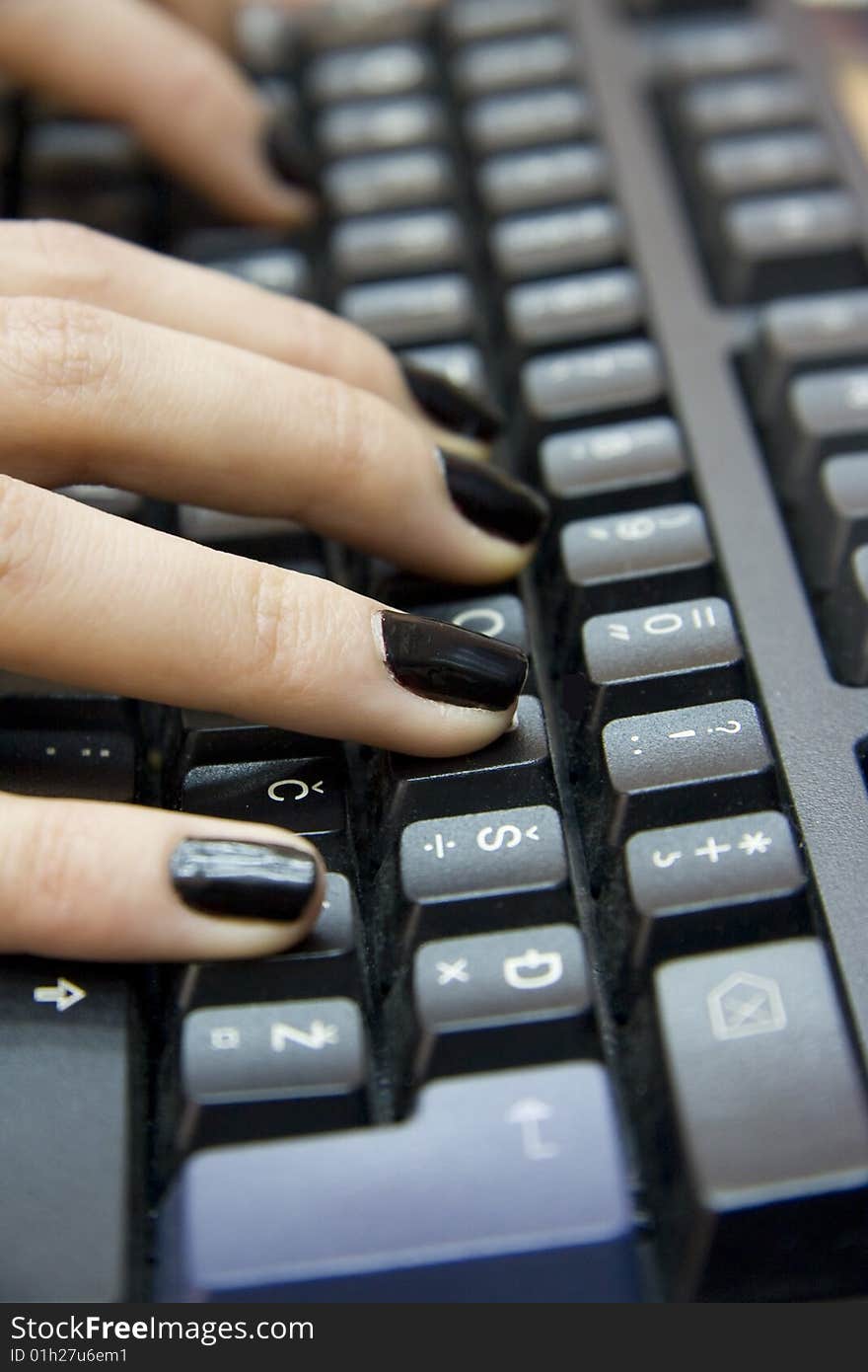 Computer keyboard and woman`s hands typing on it. Computer keyboard and woman`s hands typing on it.