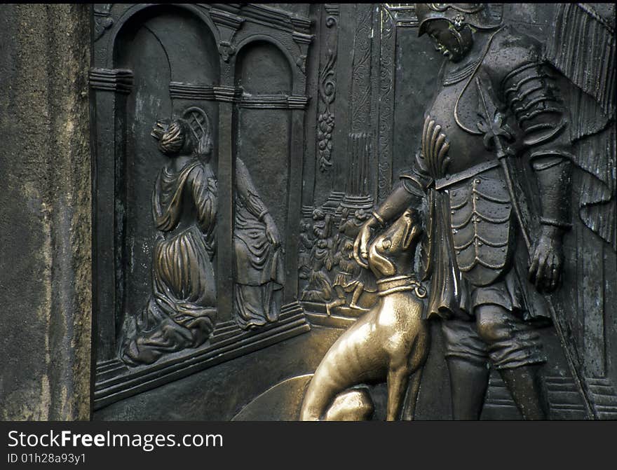 Chalcography with a dog, at a castel gate in Prague , Europe