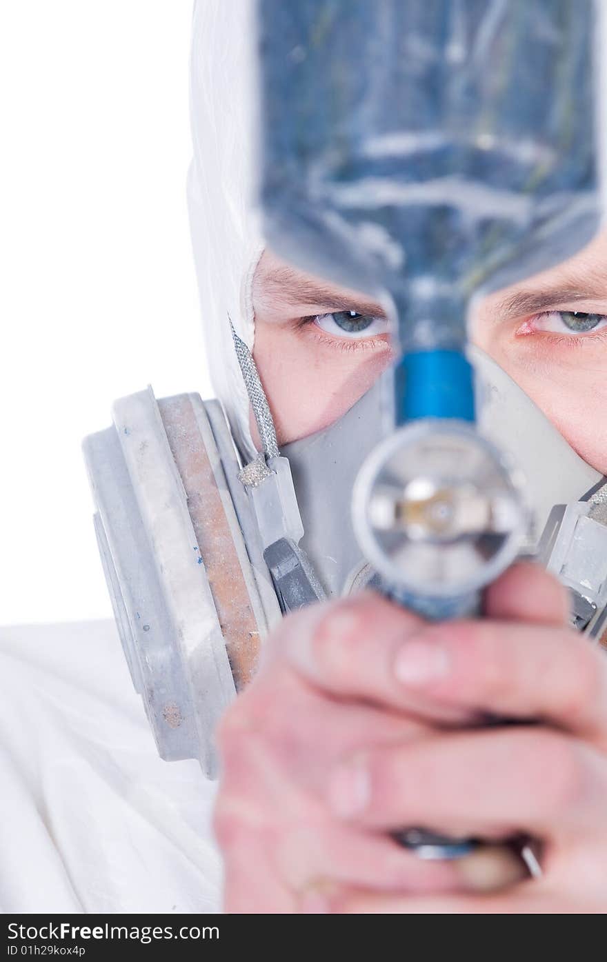 Man with airbrush gun, focus on face. Man with airbrush gun, focus on face