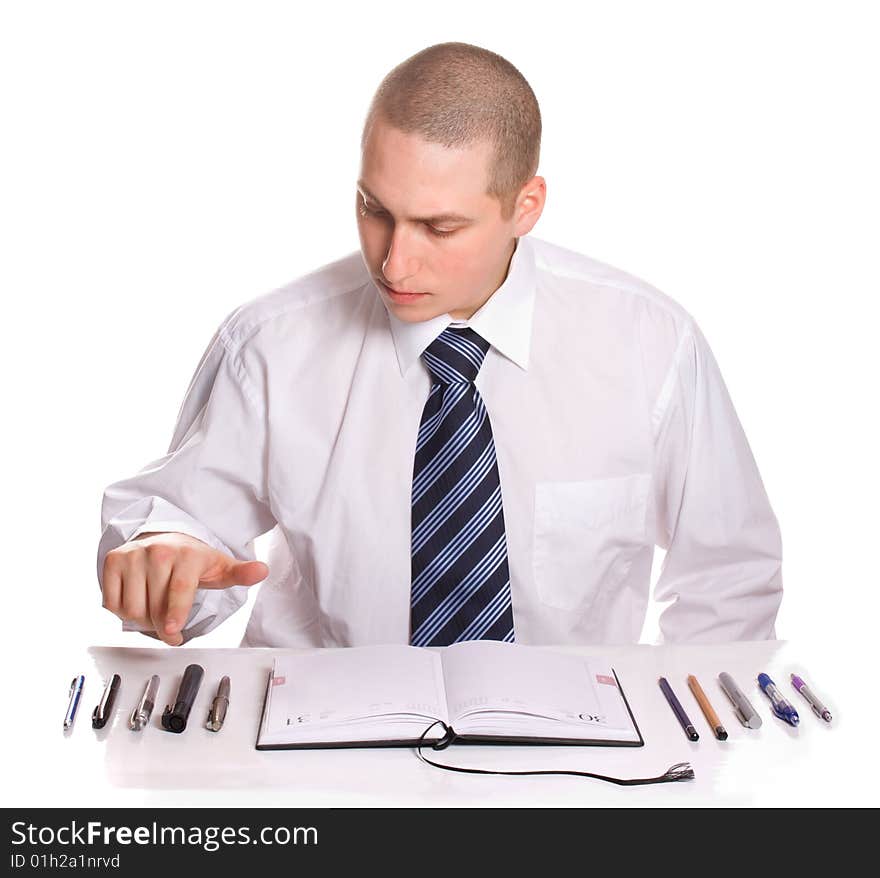 The man chooses  pen.Isolated on white. The man chooses  pen.Isolated on white.