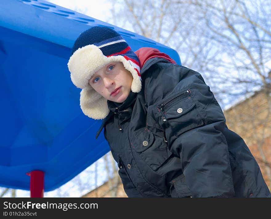 Blue-eyed boy in the winter stroll