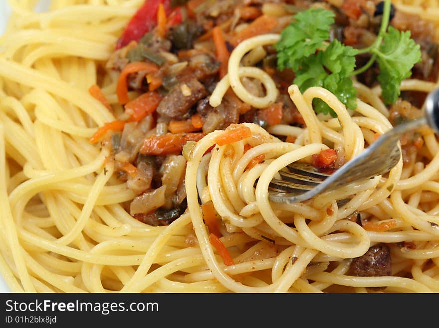 Dinner plate with spaghetti.