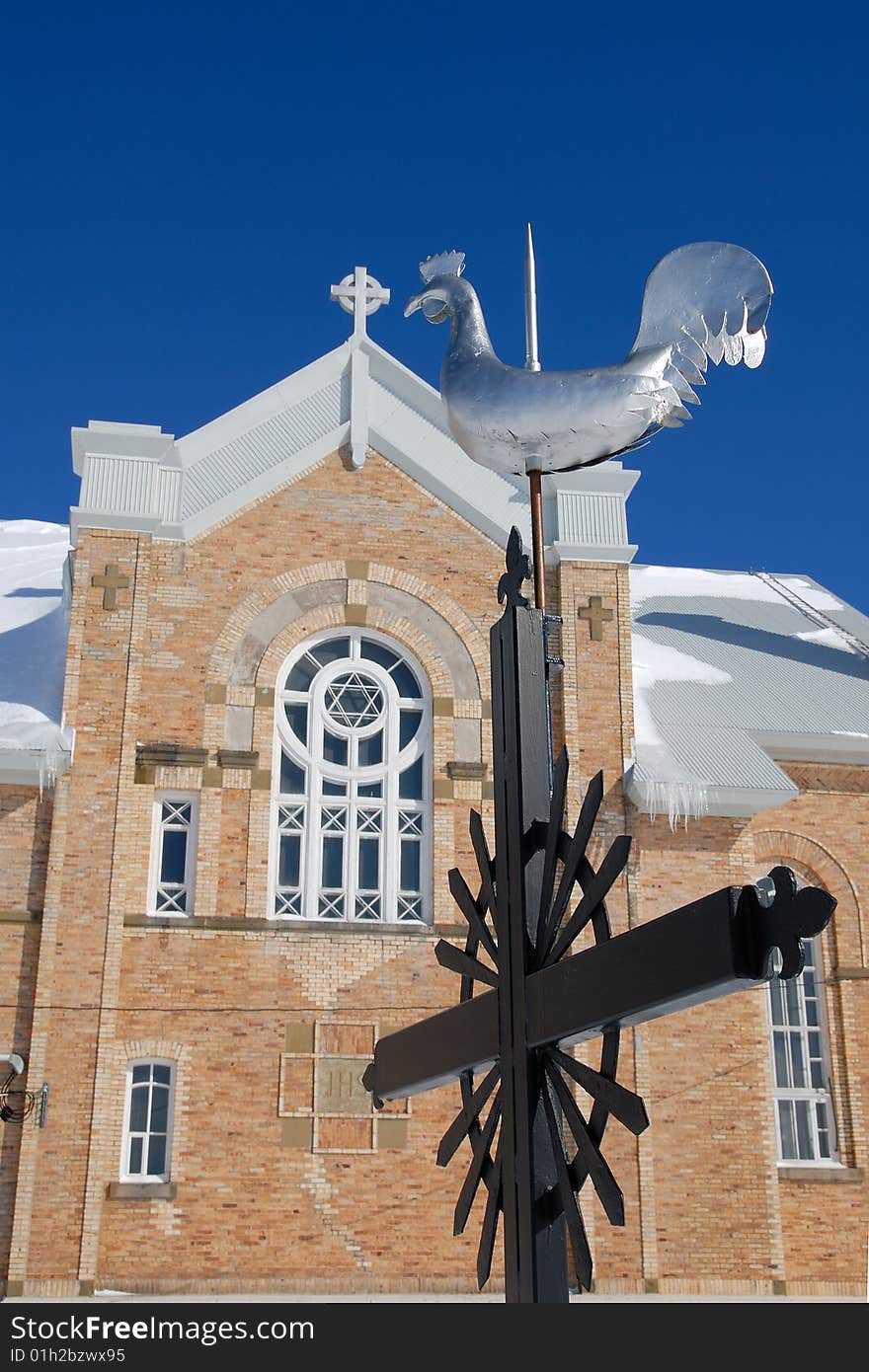 Church rooster with blue sky