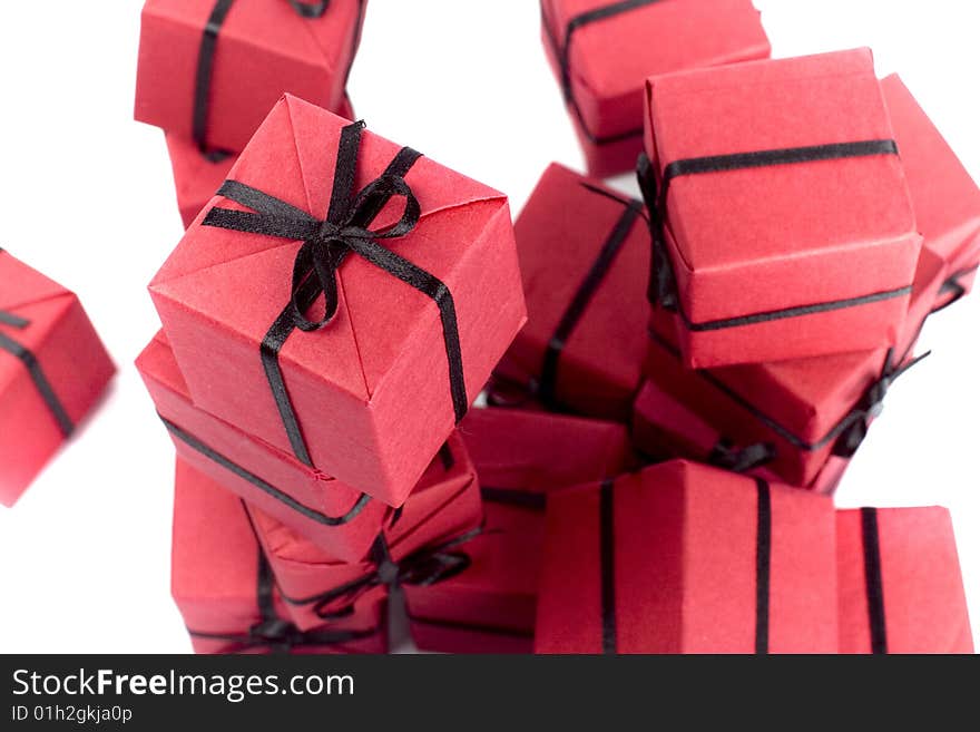 Red gift boxes closeup on white background