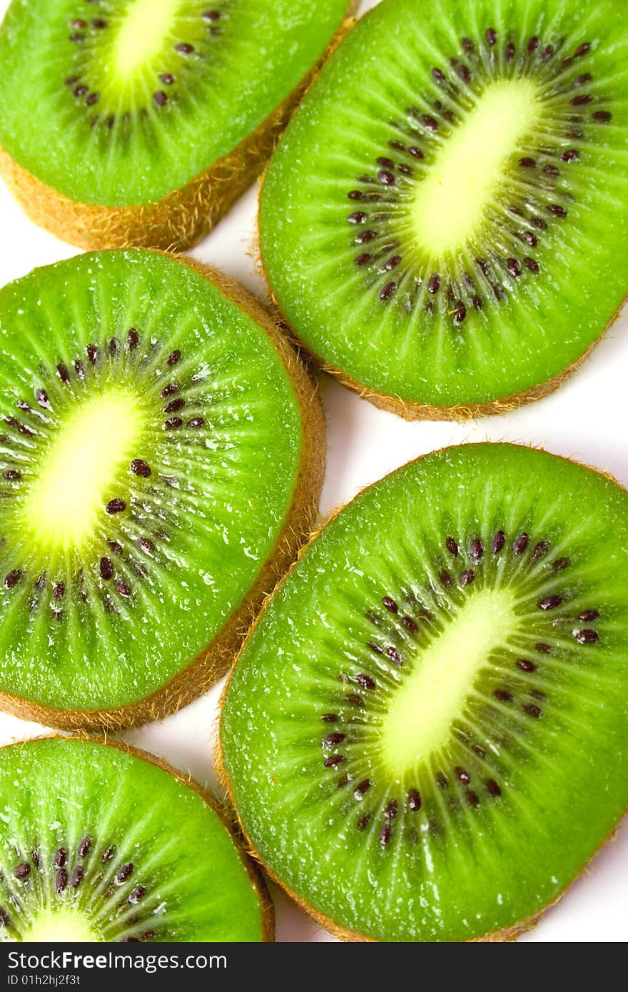 Green fresh kiwi slices background .