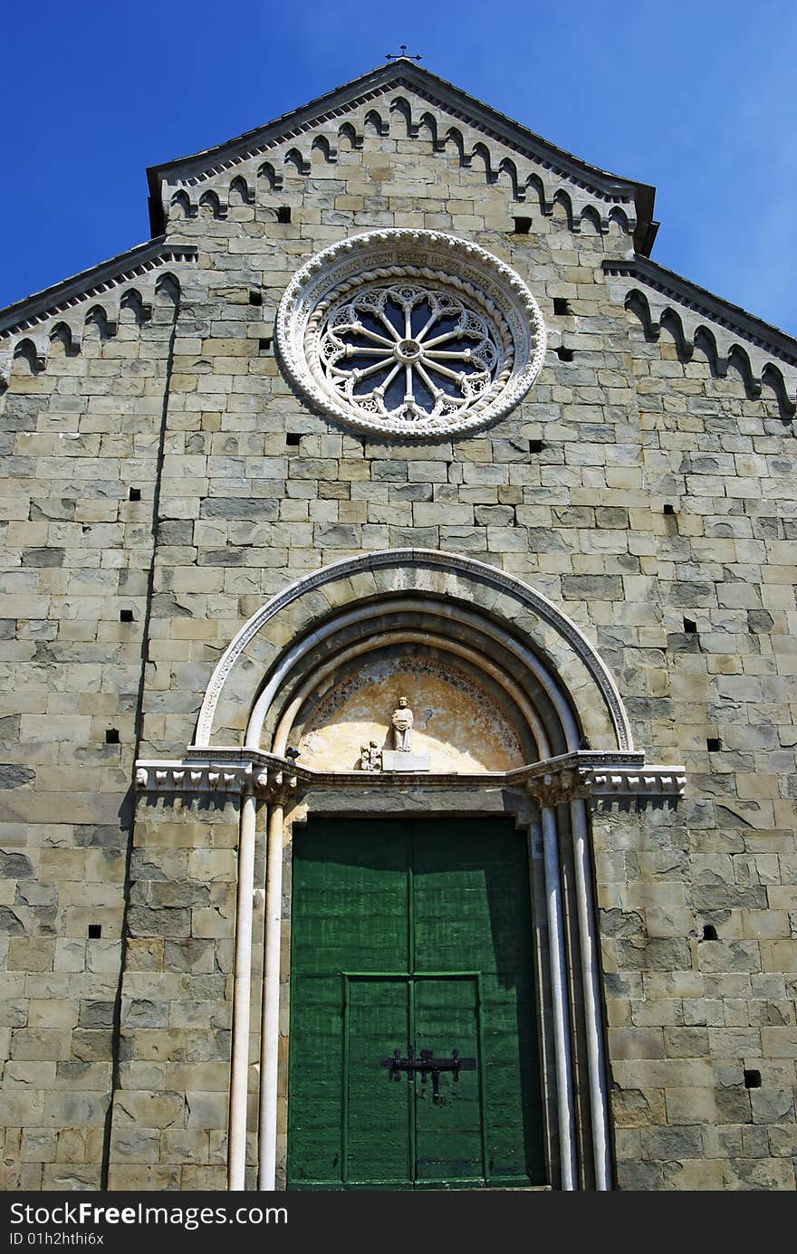 Old church at 5 terre italy with romanic rose window (or Catherine window) is often used as a generic term applied to a circular window, but is especially used for those found in churches. Old church at 5 terre italy with romanic rose window (or Catherine window) is often used as a generic term applied to a circular window, but is especially used for those found in churches