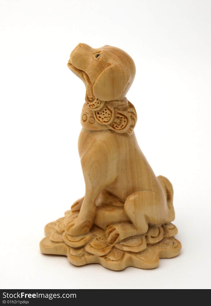 Wooden dog of handwork of master from the tree of mango. Wooden dog of handwork of master from the tree of mango