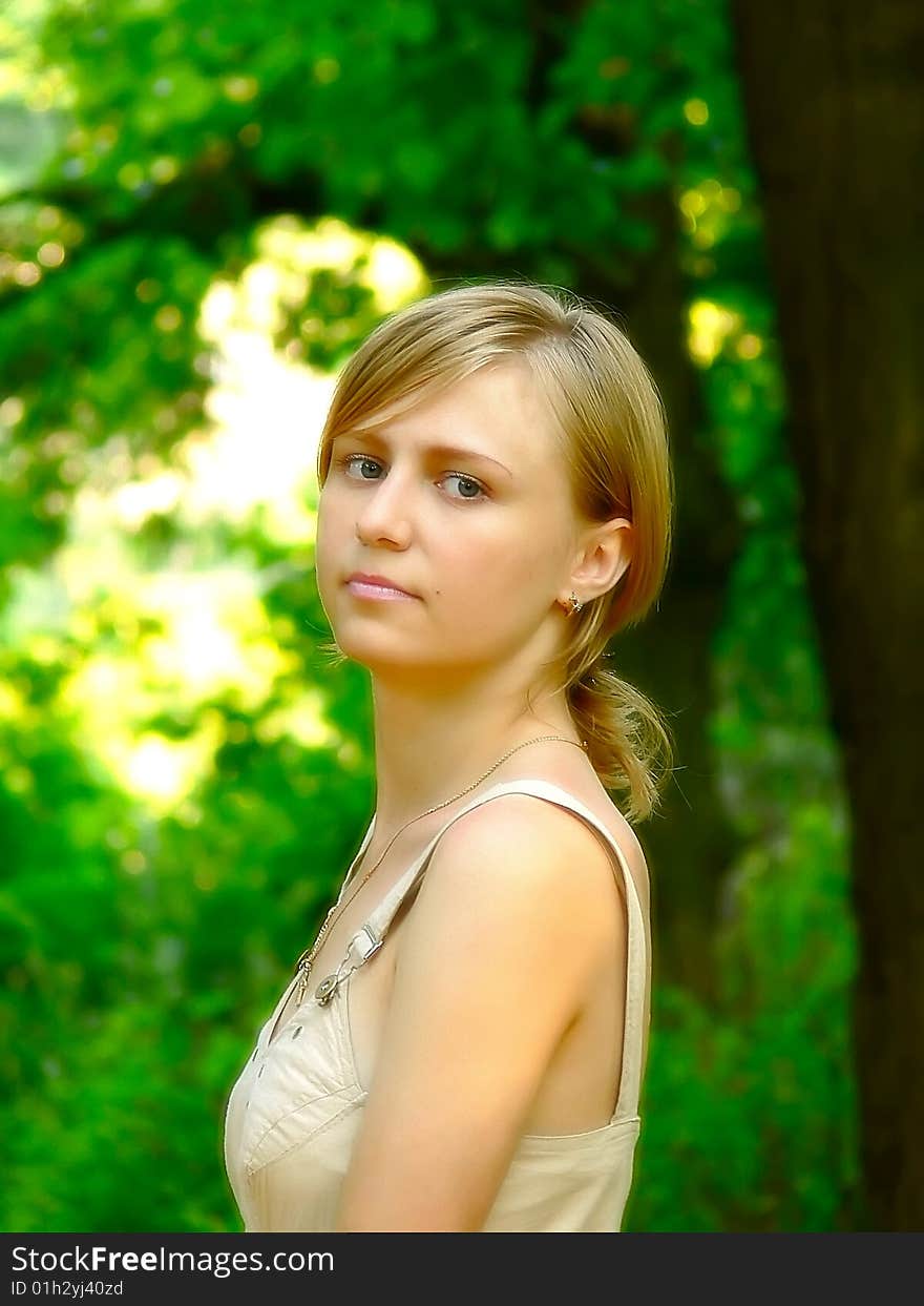 Young girl on a green background