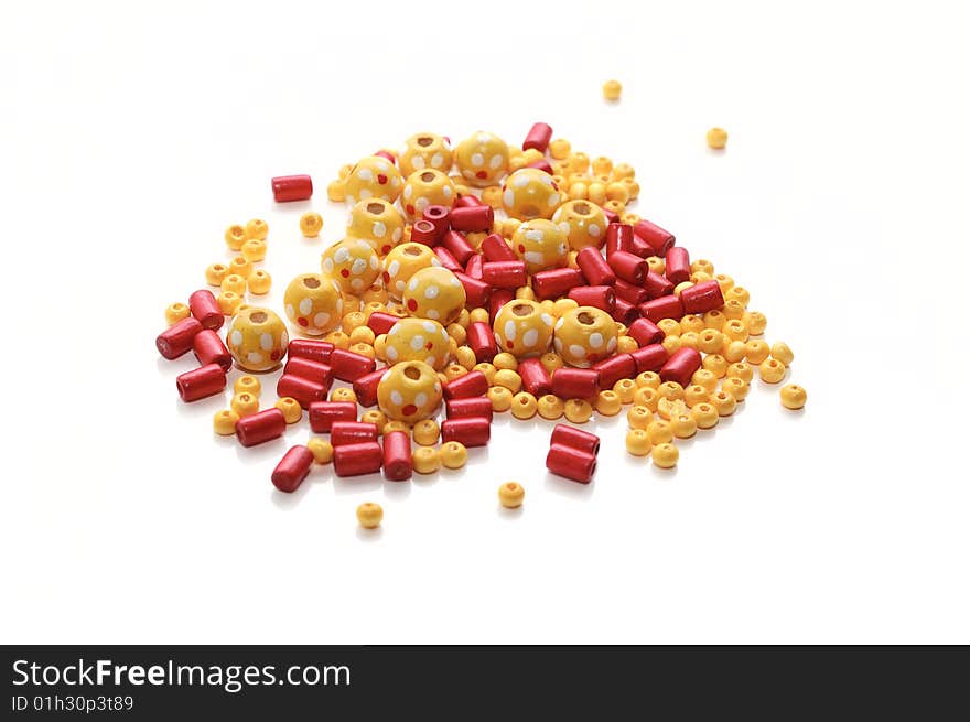 Yellow and red  wooden beads. Isolated. Yellow and red  wooden beads. Isolated