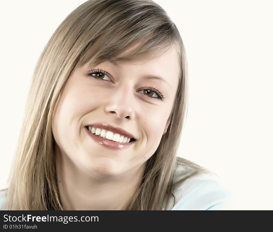 Closeup portrait of a happy young woman smiling isolated on white background