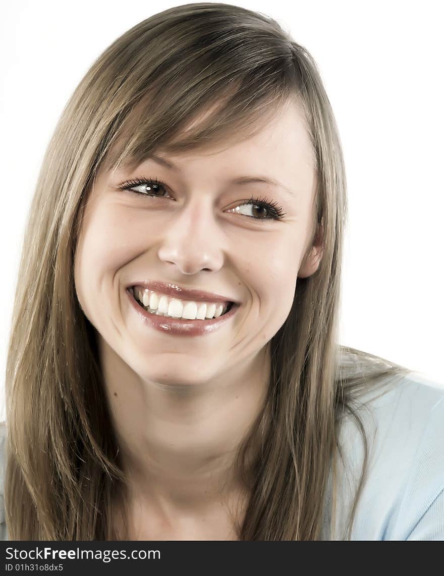 Closeup portrait of a happy young woman smiling isolated on white background