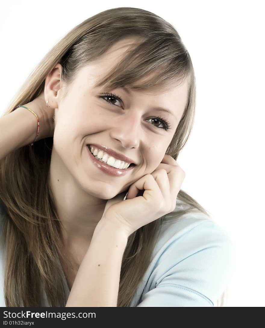 Closeup portrait of a happy young woman smiling isolated on white background