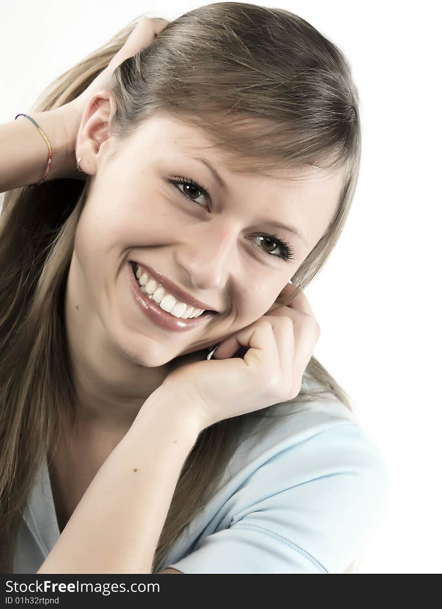 Closeup portrait of a happy young woman smiling isolated on white background