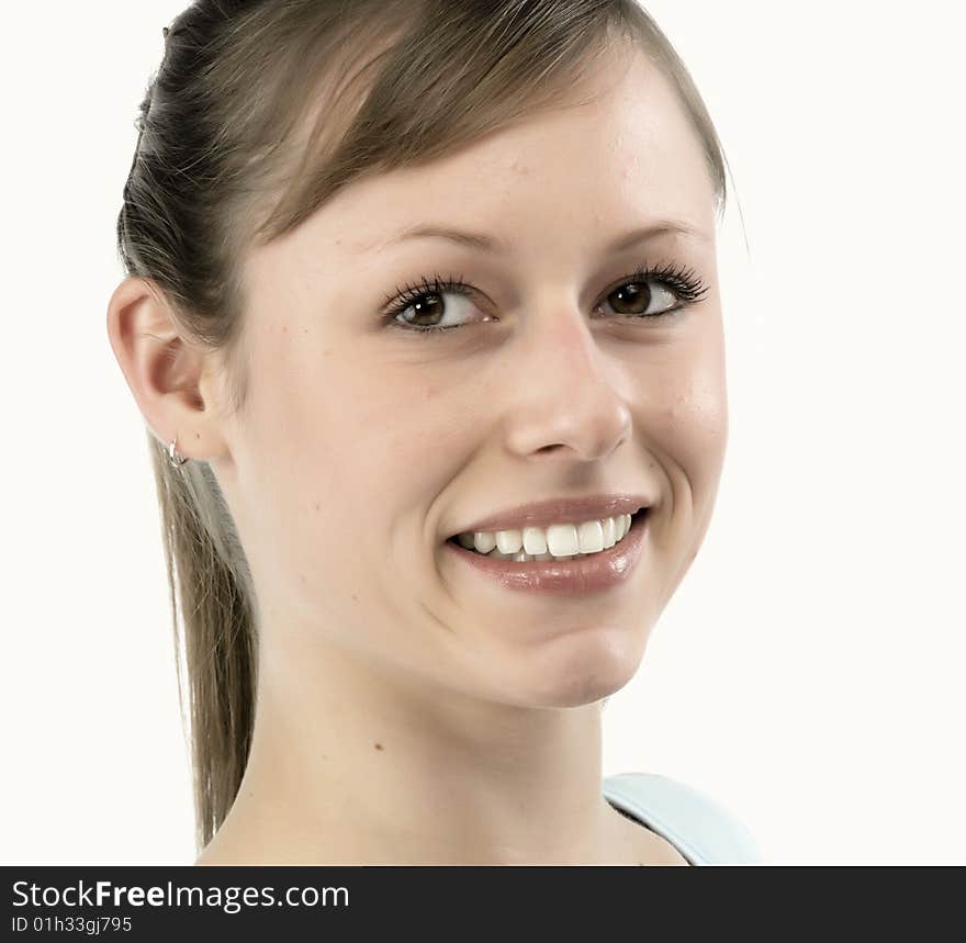 Closeup portrait of a happy young woman smiling isolated on white background