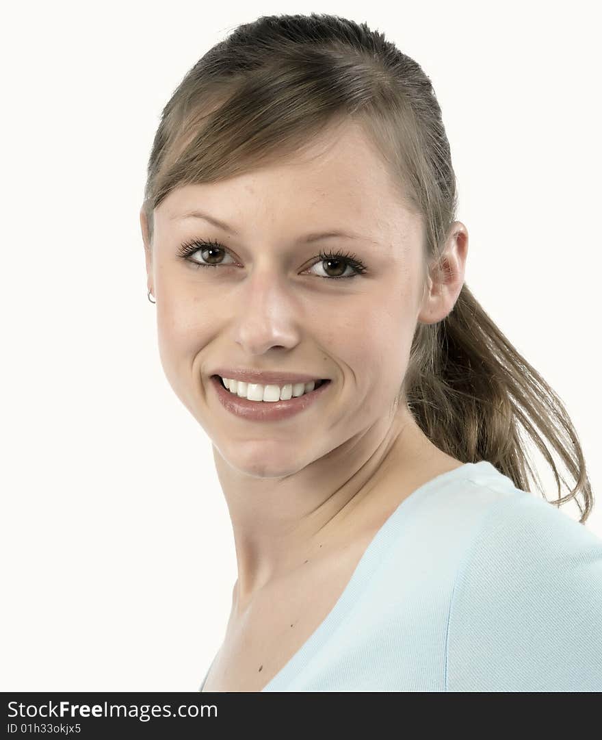 Closeup portrait of a happy young woman smiling isolated on white background