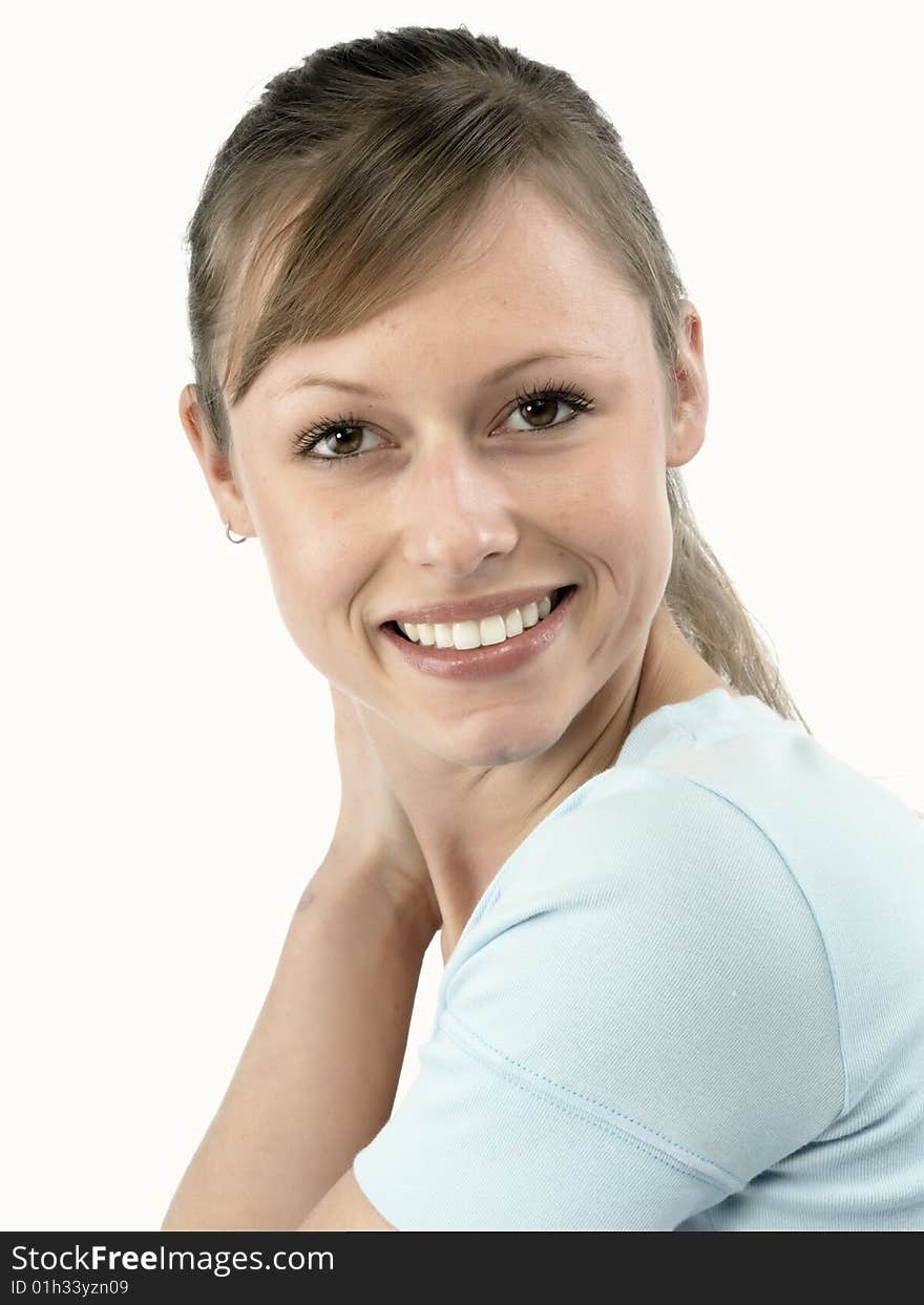 Closeup portrait of a happy young woman smiling isolated on white background