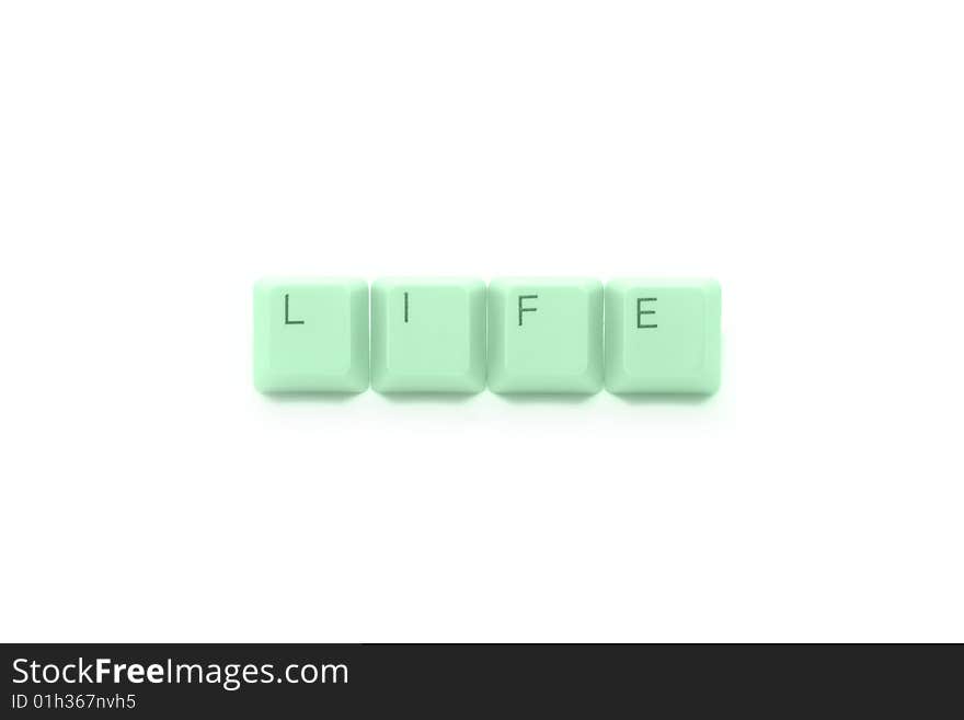 Green LIFE caption by keyboard keys isolated on white background