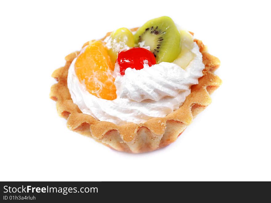 Cupcake with cream and fruits on white background