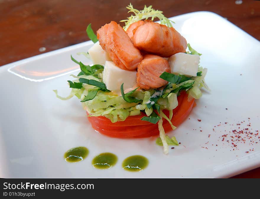 Salad From Fresh Vegetables With Pieces Of Salmon