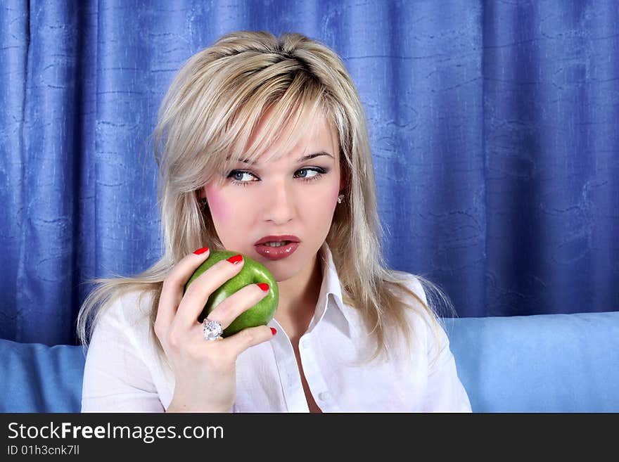 Lovely girl with apple in room