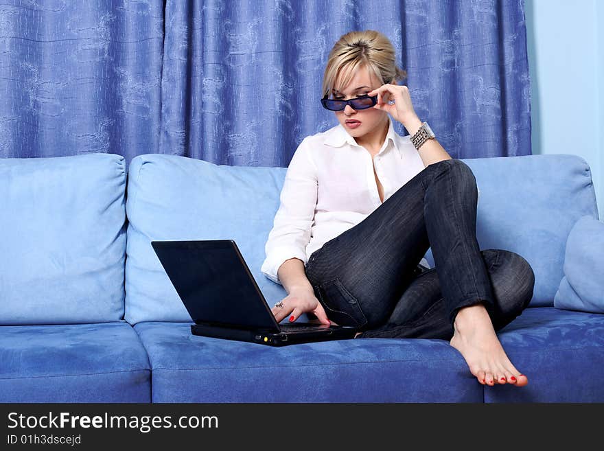 Lovely woman with notebook in sofa