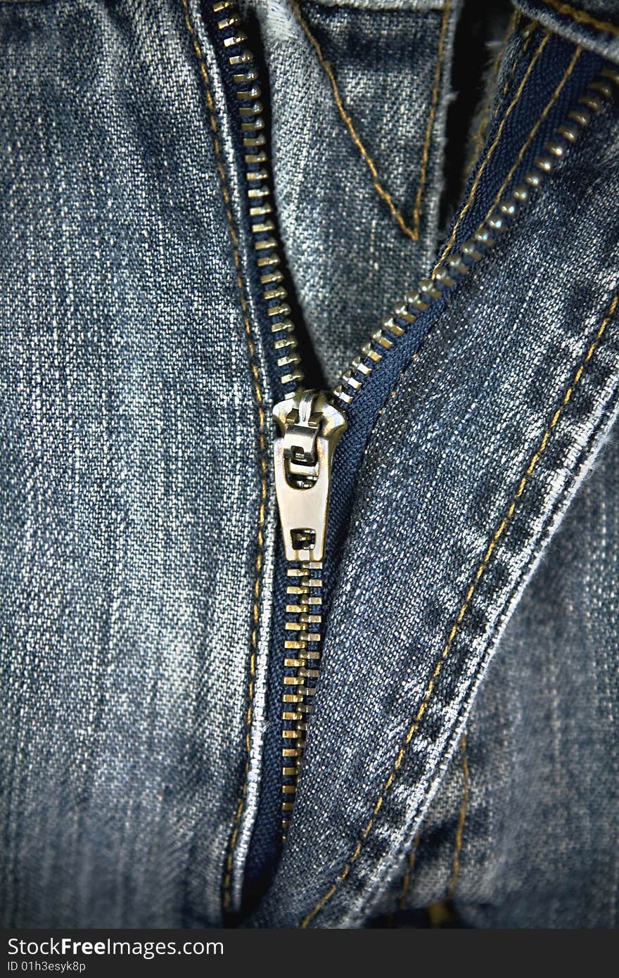 Close up view of jean fabric and zipper. Close up view of jean fabric and zipper.