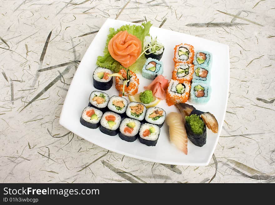 Sushi assortment isolated on a white dish. Sushi assortment isolated on a white dish