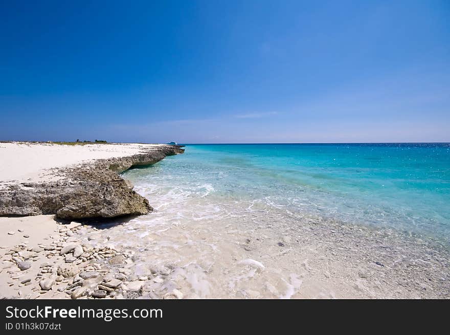 Turquoise Sea View With Rocky Shore