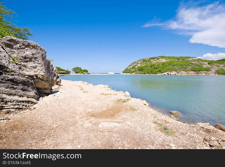 Turquoise Lagune View With Rocky Shore