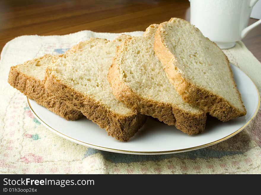 Fresh baked bread on saucer ready to eat or serve